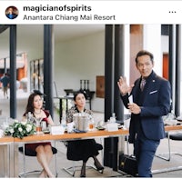 a group of people sitting at a table at a restaurant