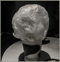 a white ice cream cone sitting on a table