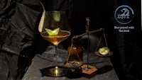 a glass with a lime and a scale on it